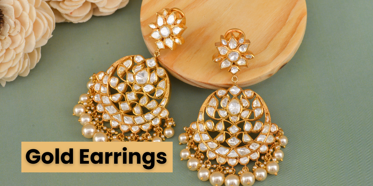 two gold earrings 