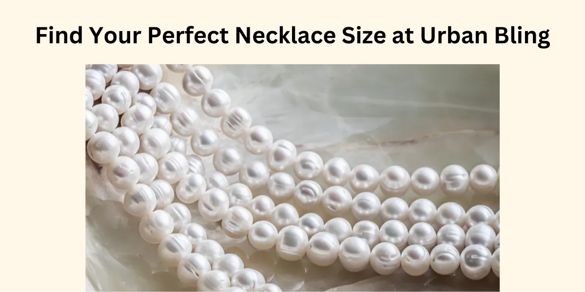 Close-up of white pearl necklaces on a marble surface, promoting Urban Bling's perfect necklace size guide